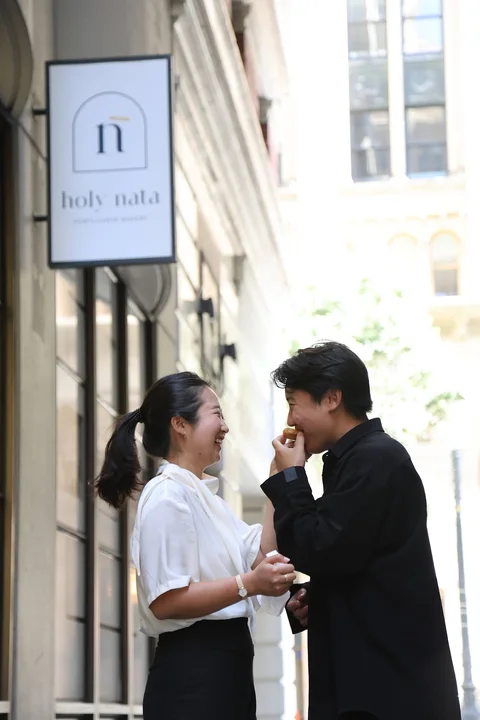 Nam-Hee and Hiroo together outside a café.